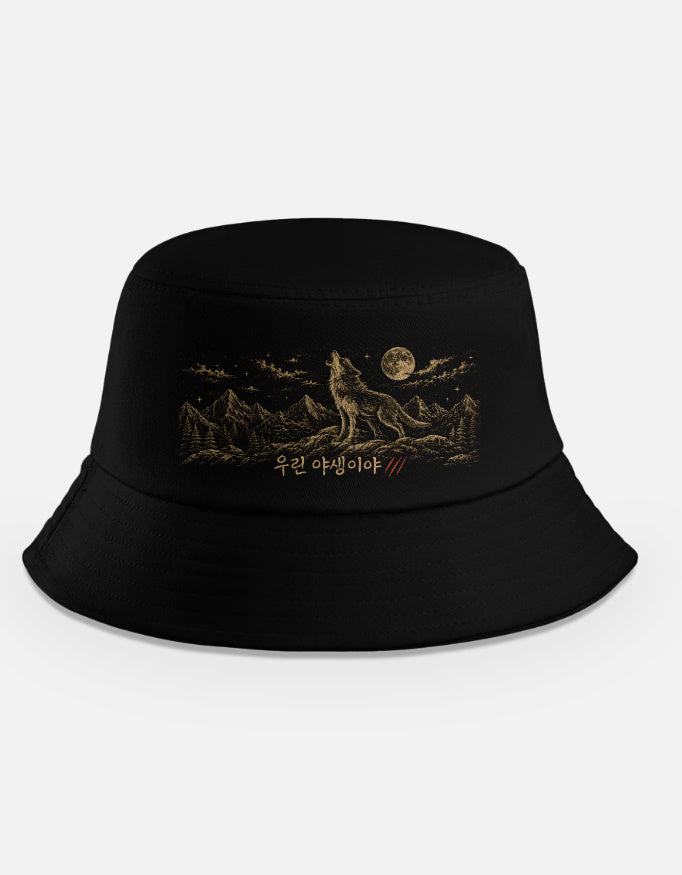 "Black bucket hat with howling wolf and full moon design inspired by BTS Like Animals, with Korean text 우린 야생이야"